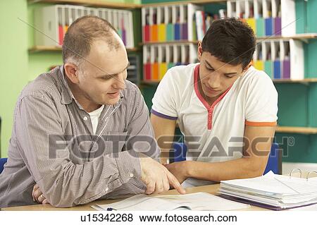 Teenage Student In Classroom With Tutor View Large Photo Image Stock Photo - Teenage Student In Classroom With Tutor. Fotosearch