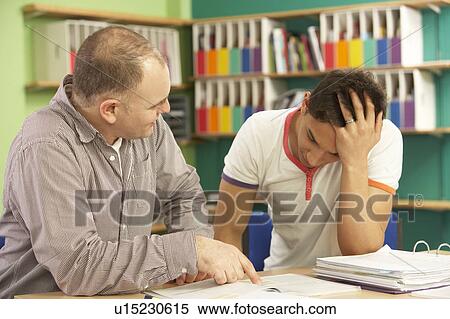Teenage Student In Classroom With Tutor View Large Photo Image Stock Photography - Teenage Student In Classroom With Tutor. Fotosearch