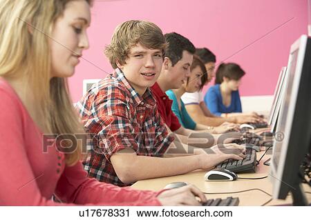 Stock Image - Teenage Students In IT Class Using Computers In Classroom. Fotosearch