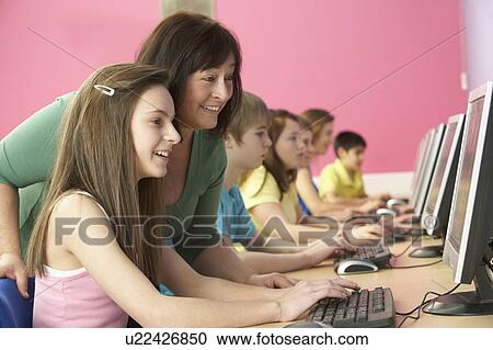 Teenage Students In IT Class Using Computers In Classroom With T View Large Photo Image Stock Image - Teenage Students In IT Class Using Computers In Classroom With T. Fotosearch