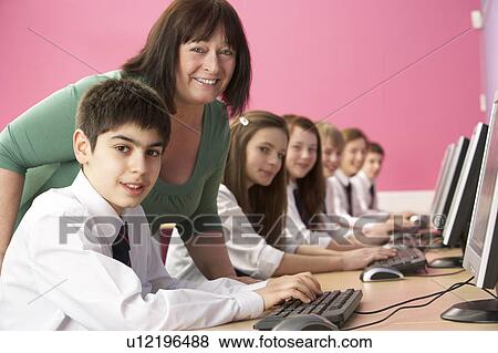 Teenage Students In IT Class Using Computers In Classroom With T View Large Photo Image Stock Photo - Teenage Students In IT Class Using Computers In Classroom With T. Fotosearch