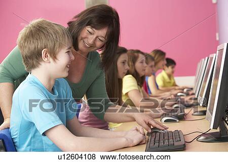 Teenage Students In IT Class Using Computers In Classroom With T View Large Photo Image Stock Photo - Teenage Students In IT Class Using Computers In Classroom With T. Fotosearch