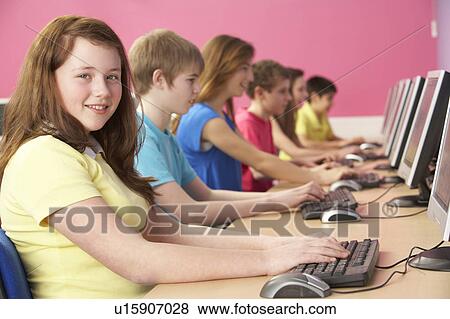 Stock Photo - Teenage Students In IT Class Using Computers In Classroom. Fotosearch