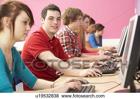 Stock Photo - Teenage Students In IT Class Using Computers In Classroom. Fotosearch