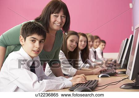 Teenage Students In IT Class Using Computers In Classroom With T View Large Photo Image Stock Photography - Teenage Students In IT Class Using Computers In Classroom With T. Fotosearch