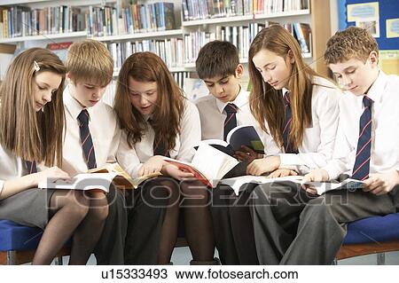 Teenage Students In Library Reading Books View Large Photo Image Stock Image - Teenage Students In Library Reading Books. Fotosearch