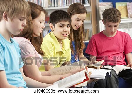 Teenage Students In Library Reading Books View Large Photo Image Stock Photography - Teenage Students In Library Reading Books. Fotosearch