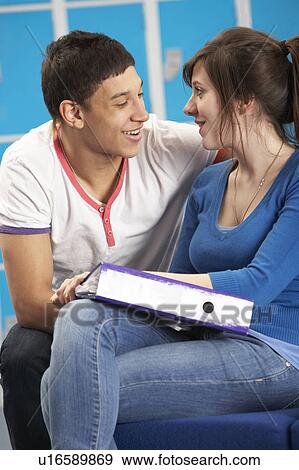 Teenage Students Relaxing By Lockers In School View Large Photo Image Stock Photo - Teenage Students Relaxing By Lockers In School. Fotosearch