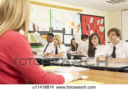 Teenage Students Studying In Classroom With Teacher View Large Photo Image Picture - Teenage Students Studying In Classroom With Teacher. Fotosearch