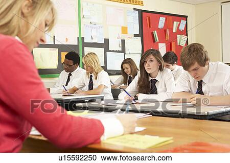 Teenage Students Studying In Classroom With Teacher View Large Photo Image Stock Image - Teenage Students Studying In Classroom With Teacher. Fotosearch