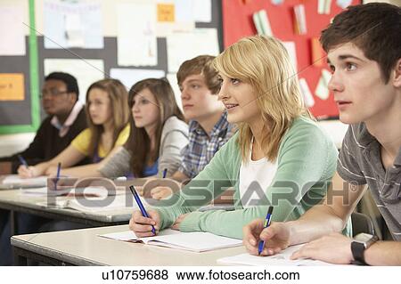Stock Photo - Teenage Students Studying In Classroom. Fotosearch