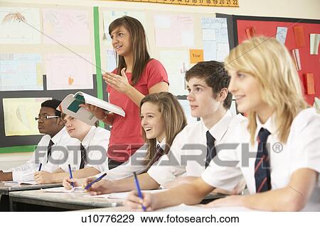 Teenage Students Studying In Classroom With Teacher View Large Photo Image Stock Photo - Teenage Students Studying In Classroom With Teacher. Fotosearch