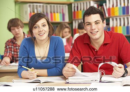 Stock Photo - Teenage Students Studying In Classroom. Fotosearch