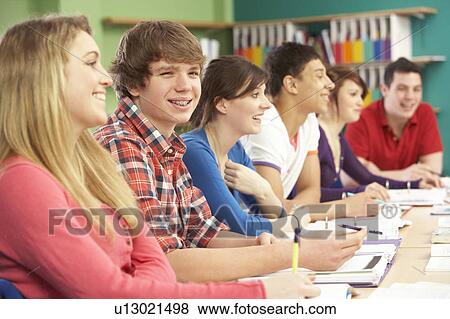 Stock Photo - Teenage Students Studying In Classroom. Fotosearch