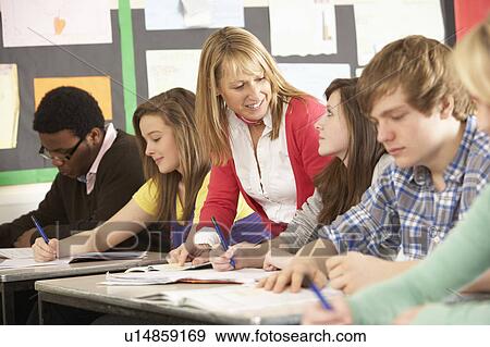 Teenage Students Studying In Classroom With Teacher View Large Photo Image Stock Photo - Teenage Students Studying In Classroom With Teacher. Fotosearch
