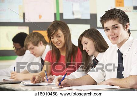 Teenage Students Studying In Classroom With Teacher View Large Photo Image Stock Photo - Teenage Students Studying In Classroom With Teacher. Fotosearch