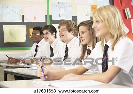 Stock Photo - Teenage Students Studying In Classroom. Fotosearch