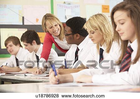 Teenage Students Studying In Classroom With Teacher View Large Photo Image Stock Photo - Teenage Students Studying In Classroom With Teacher. Fotosearch