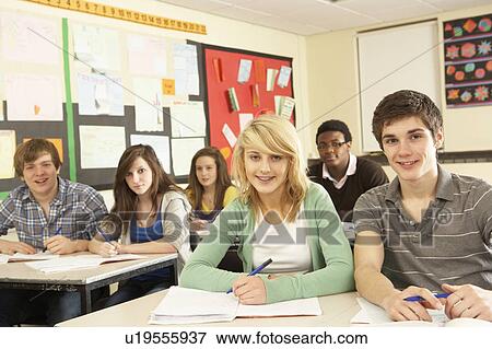 Stock Photo - Teenage Students Studying In Classroom. Fotosearch