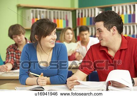 Stock Photograph - Teenage Students Studying In Classroom. Fotosearch