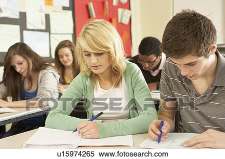 Stock Photography - Teenage Students Studying In Classroom. Fotosearch