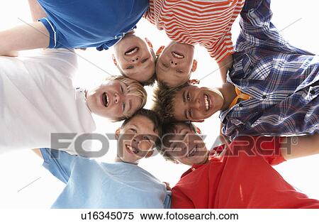 Stock Photography - Teenagers in circle. Fotosearch