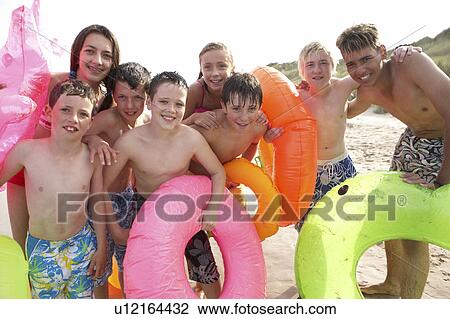 Teenagers on beach View Large Photo Image Stock Image - Teenagers on beach. Fotosearch