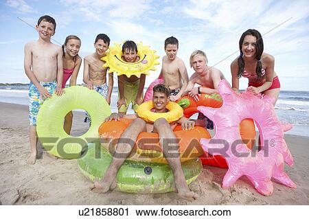 Teenagers on beach View Large Photo Image Stock Image - Teenagers on beach. Fotosearch