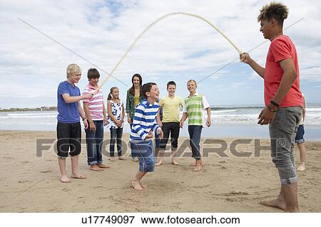 Teenagers playing skipping rope View Large Photo Image Stock Photo - Teenagers playing skipping rope. Fotosearch
