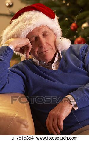 Tired Senior Man Relaxing In Front Of Christmas Tree View Large Photo Image Picture - Tired Senior Man Relaxing In Front Of Christmas Tree. Fotosearch