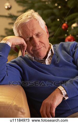 Tired Senior Man Relaxing In Front Of Christmas Tree View Large Photo Image Stock Image - Tired Senior Man Relaxing In Front Of Christmas Tree. Fotosearch