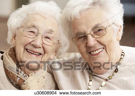 Picture - Two Senior Women Friends At Day Care Centre. Fotosearch