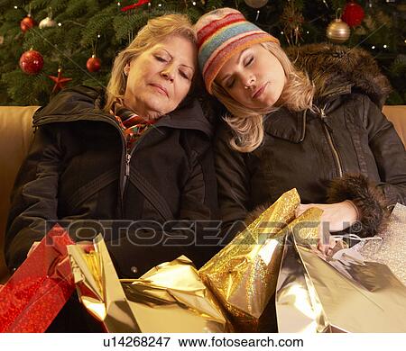 Two Women Returning After Christmas Shopping Trip View Large Photo Image Stock Photo - Two Women Returning After Christmas Shopping Trip. Fotosearch