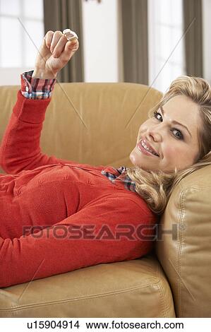 Picture - Woman Looking At Result Of Home Pregnancy Test Kit. Fotosearch
