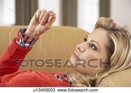 Woman Looking At Result Of Home Pregnancy Test Kit View Large Photo Image Stock Image - Woman Looking At Result Of Home Pregnancy Test Kit. Fotosearch
