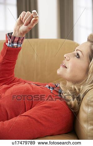 Woman Looking At Result Of Home Pregnancy Test Kit View Large Photo Image Stock Photo - Woman Looking At Result Of Home Pregnancy Test Kit. Fotosearch