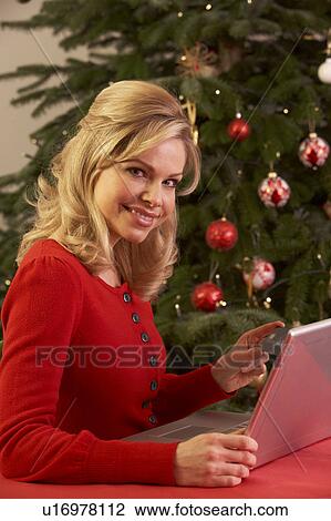 Woman Shopping Online For Christmas Gifts View Large Photo Image Stock Image - Woman Shopping Online For Christmas Gifts. Fotosearch