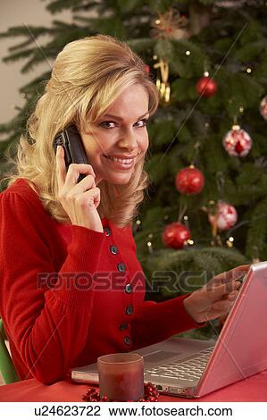 Woman Shopping Online For Christmas Gifts On Phone View Large Photo Image Stock Image - Woman Shopping Online For Christmas Gifts On Phone. Fotosearch