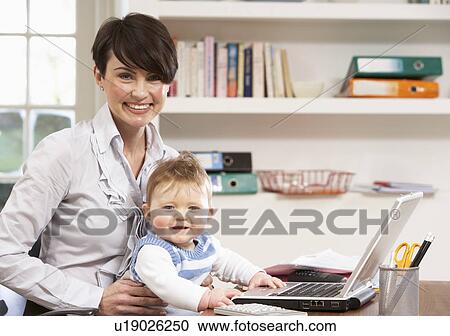 Woman With Baby Working From Home Using Laptop View Large Photo Image Stock Image - Woman With Baby Working From Home Using Laptop. Fotosearch