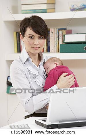 Woman With Newborn Baby Working From Home Using Laptop View Large Photo Image Stock Image - Woman With Newborn Baby Working From Home Using Laptop. Fotosearch