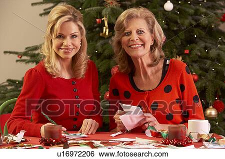 Stock Photograph - Women Making Christmas Cards At Home. Fotosearch