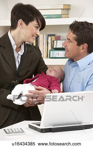 Working Mother Leaving Baby With Father Who Works From Home View Large Photo Image Stock Photography - Working Mother Leaving Baby With Father Who Works From Home. Fotosearch