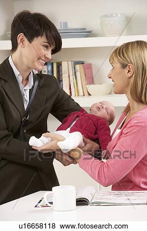 Stock Photo - Working Mother Leaving Baby With Nanny. Fotosearch