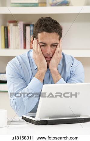 Worried Looking Man Working From Home Using Laptop View Large Photo Image Stock Image - Worried Looking Man Working From Home Using Laptop. Fotosearch