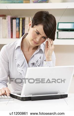 Worried Looking Woman Working From Home Using Laptop View Large Photo Image Stock Image - Worried Looking Woman Working From Home Using Laptop. Fotosearch