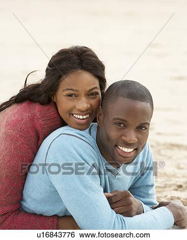 Stock Photograph - Young Couple Embracing. Fotosearch