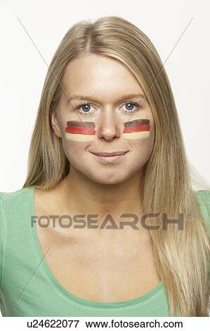 Stock Photo - Young Female Sports Fan With German Flag Painted On Face. Fotosearch
