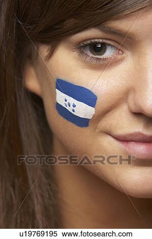 Stock Photography - Young Female Sports Fan With Honduran Flag Painted On Face. Fotosearch