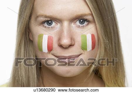 Stock Image - Young Female Sports Fan With Italian Flag Painted On Face. Fotosearch