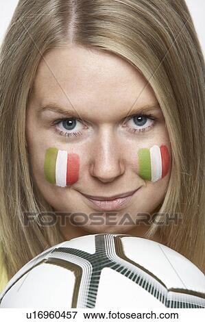 Stock Photo - Young Female Sports Fan With Italian Flag Painted On Face. Fotosearch